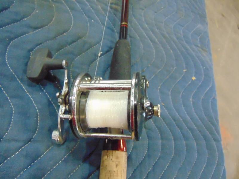 lot 71 image: Left Handed Bait Caster Reel with Rod