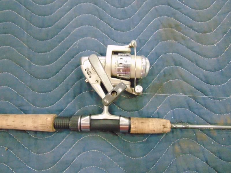 lot 72 image: (1) Spinning Reel Mounted on Rod and (1) Rod Missing a Tip