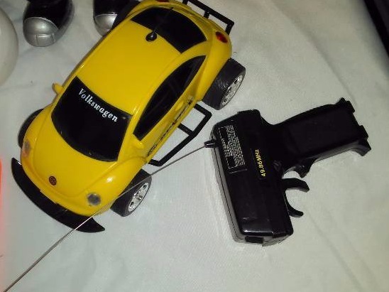 lot 5 image: Toy Figurine Lot, Monster Inc., Furbys, Mr. Potato Head, Guitar Hero, VW Beatle and more