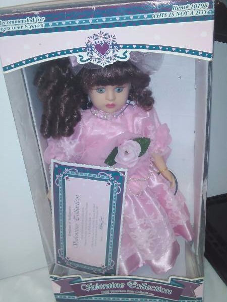 lot 66 image: Porcelain Dolls (9) New in Box