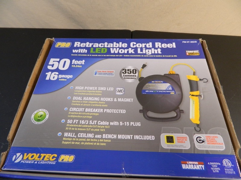 lot 65 image: New Retractable Cord Reel with LED Work Light