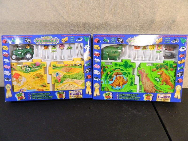 lot 85 image: 2 New Battery Poerated Vehicle Puzzle Play Sets
