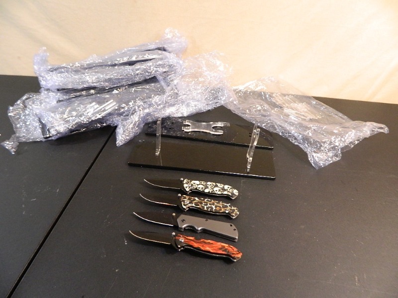 lot 201 image: 4 New Folding Knives and New Knife Displays