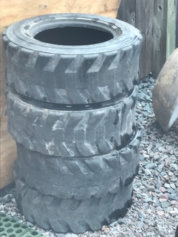 Set Of (4) Skid Loader Tires