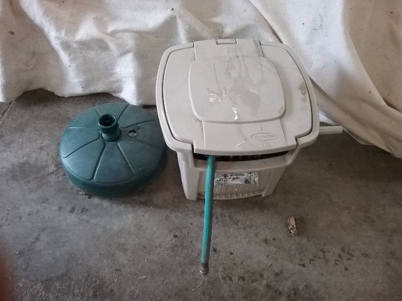 lot 53 image: Lot - Suncast Patio Hose Reel & Patio Umbrella Stand