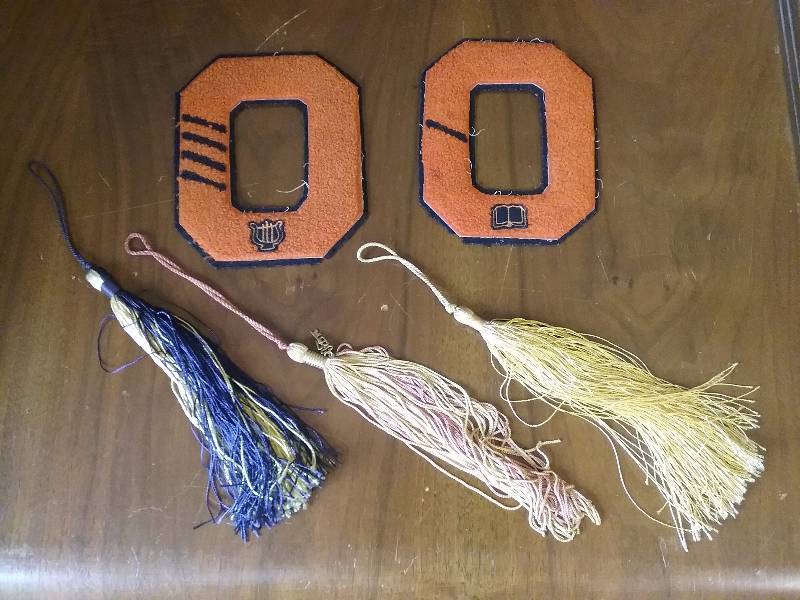 lot 6 image: Lot - Vintage High School Memorabilia, 1967 Tassle, Onamia Numbers, etc