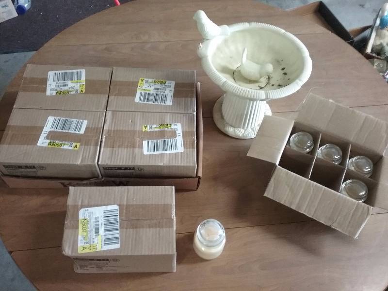 lot 192 image: Lot - New Candles (35 total, vanilla, 3oz jars) & Small Terra Cotta Birdbath 8h.