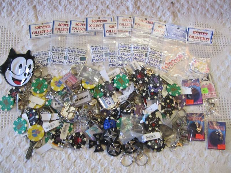 lot 124 image: Lot of keychains magnets and charms...