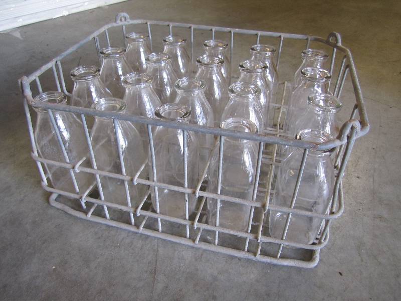 lot 131 image: Vintage metal milk crate with bottl...