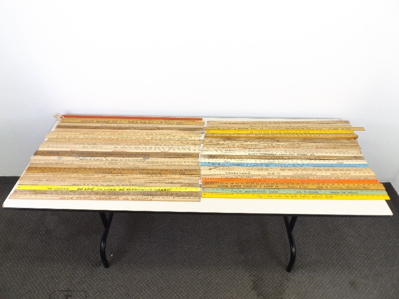lot 19 image: 40 Vintage Wood Advertising Yard Sticks