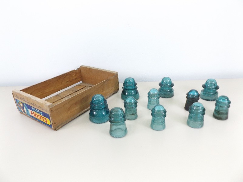 lot 39 image: Antique Blue Glass Insulators in Wood Crate