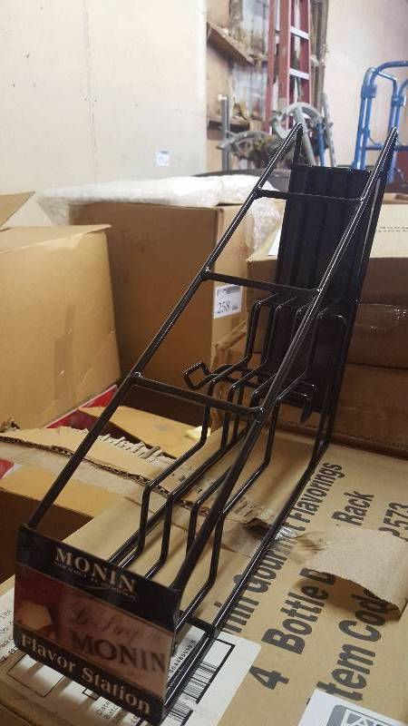 lot 307 image: Lot of (7) New In Box Monin Coffee Syrup Speed Racks