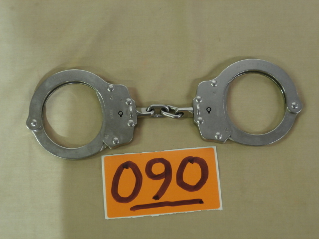lot 90 image: Pair of Peerless Regulation Handcuffs