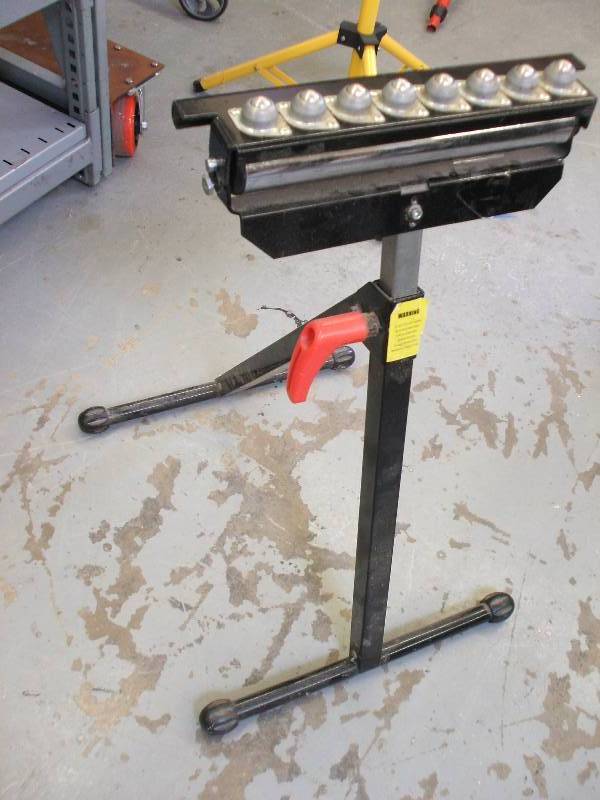 lot 611 image: STEEL SAWHORSE WITH STAINLESS STEEL ROLLER