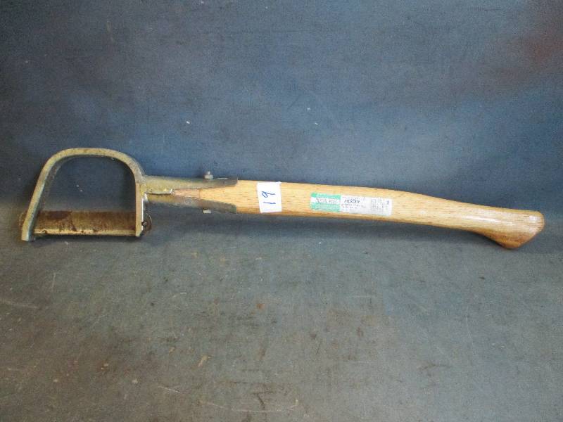 lot 19 image: Bent Fawn Foot Brush Axe