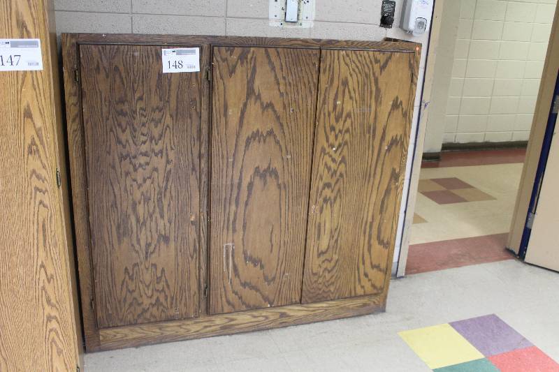 lot 148 image: 3-Door 3-Shelf Wood Cabinet