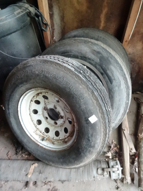lot 16 image: 3 trailer tires and rims. 5 hole. 7...
