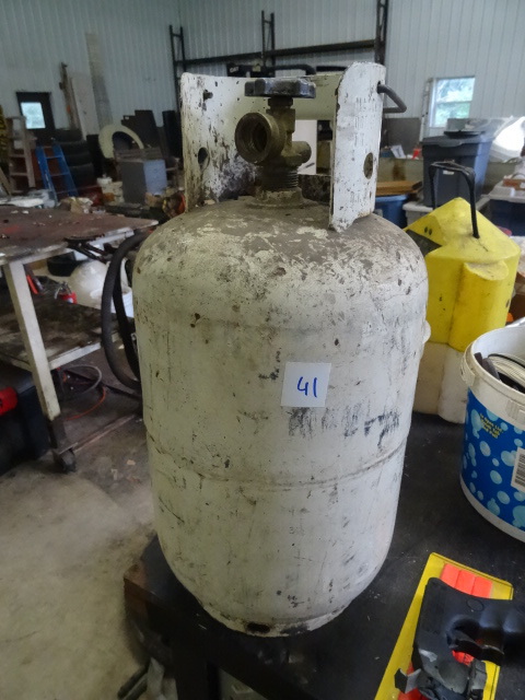 lot 41 image: Small portable camping propane tank...