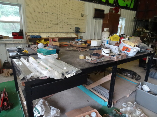 lot 60 image: Large wood framed work table. Consi...