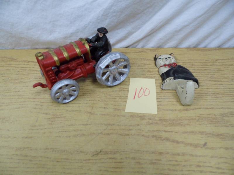 lot 100 image: Cast Iron Tractor - Cat Hook