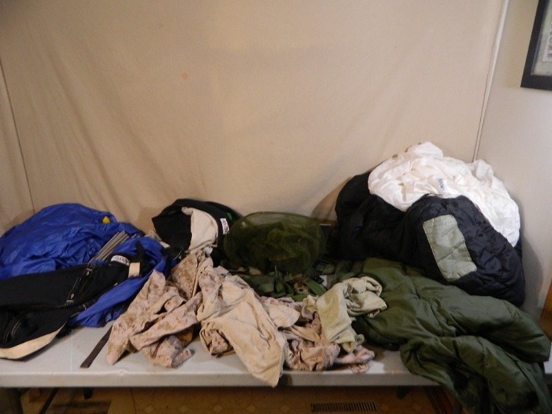lot 102 image: Army Sleeping Bag, Nomex Suits, and More