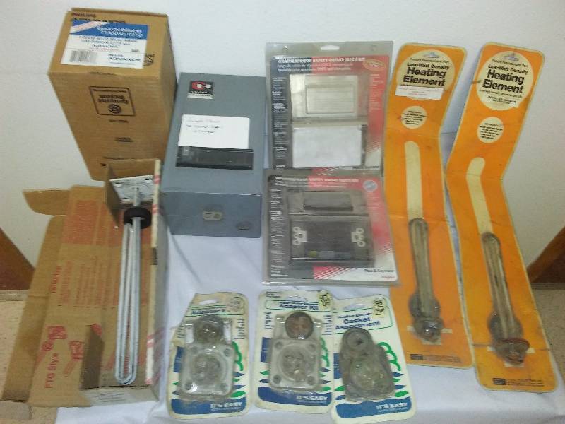 lot 54 image: GFCI Weatherproof Outlet kits (2), Single Phase NENA 1 Box, Core and Coil Ballast Kit, Water Heater elements and gasket kits and more