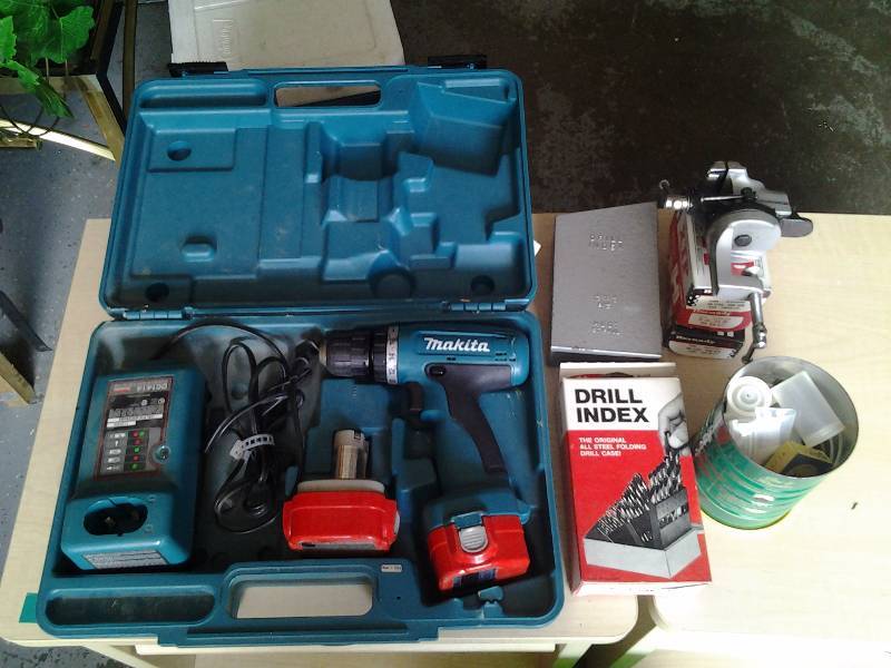 lot 11 image: Makita 12 Volt Drill With 2 Batteries, Charger, Bin Full Of Drill Indexes & Other Bits