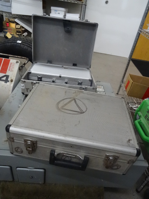 3 aluminum equipment carrying cases...