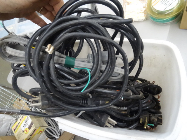Bucket full of plug in pig tails. ...