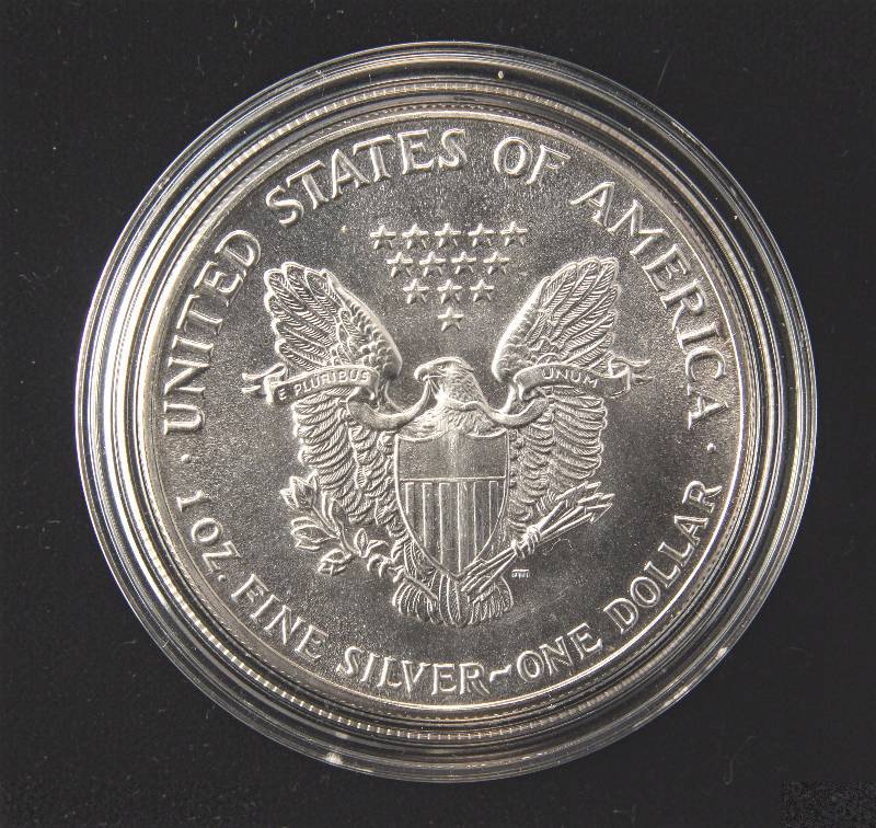 lot 83 image: 1987 AMERICAN SILVER EAGLE 1 TROY OZ. .999 FINE SILVER IN AIRTITE
