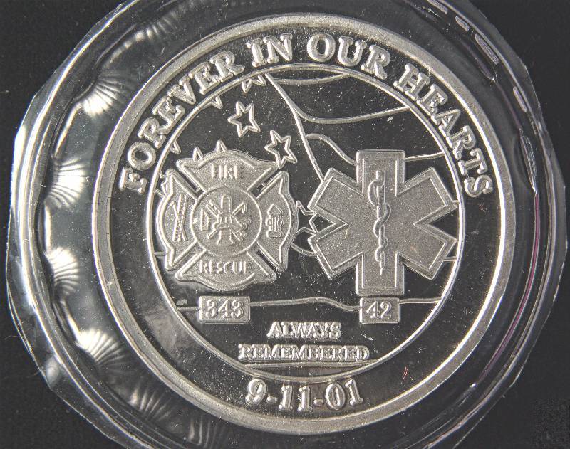 lot 14 image: 1 TROY OZ. .999 FINE SILVER WORLD TRADE CENTER ROUND SEALED
