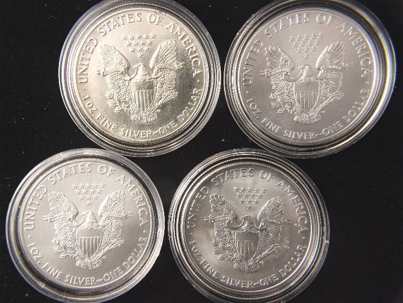 lot 120 image: GROUP OF 4 SILVER AMERICAN EAGLES IN AIRTITE HOLDERS  1987, 2003 & (2)2008