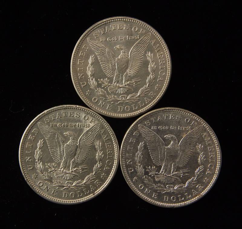 lot 162 image: GROUP OF 3 MORGAN SILVER DOLLARS AS PICTURED BU-UNC