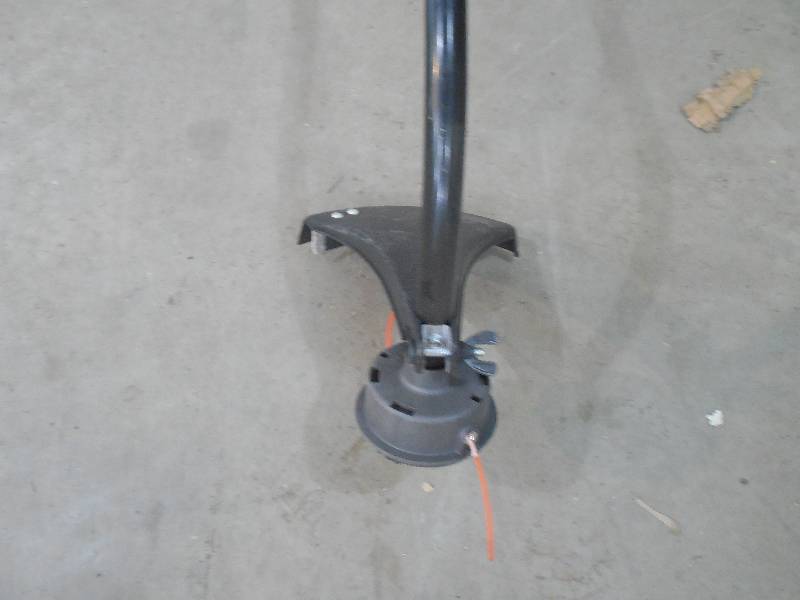 lot 95 image: 2-Cycle 25.4cc Attachment Capable Curved Shaft Gas String Trimmer