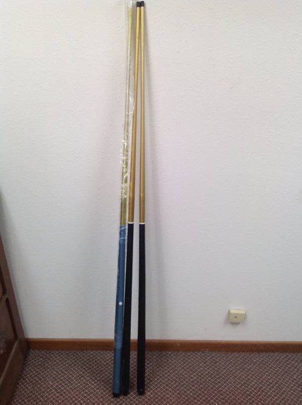 lot 7 image: Three pool Sticks.