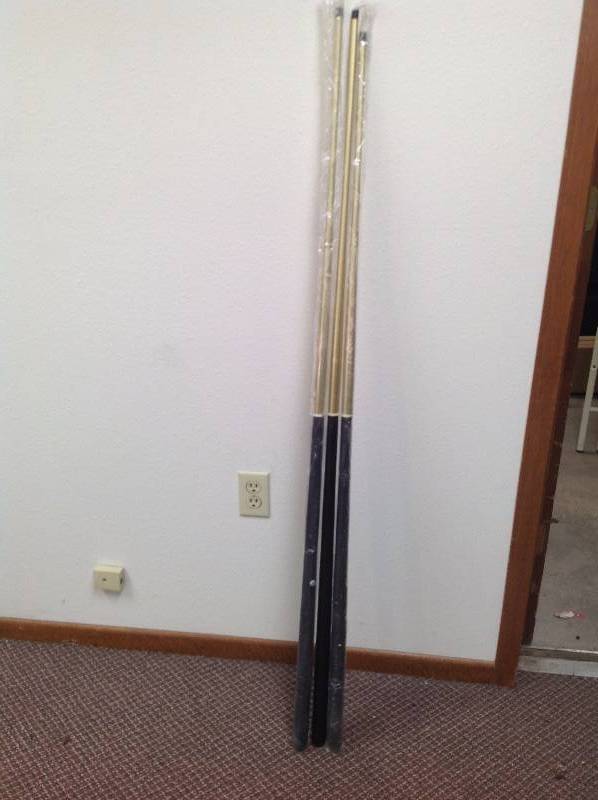lot 8 image: Three pool Sticks.