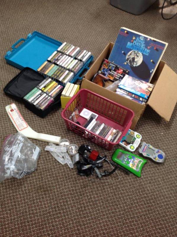 lot 11 image: Electric hand held games, cassette tapes, Vinyls,