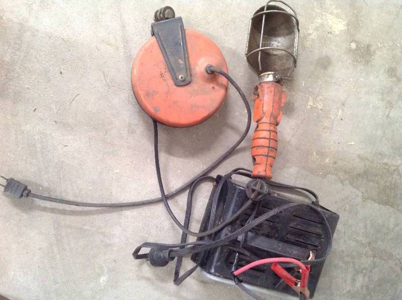lot 74 image: Trouble light and Schumacher battery charger