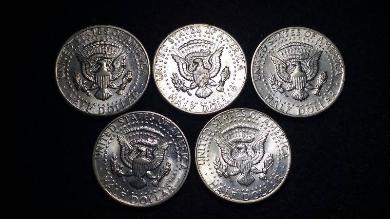 (5) Kennedy Half Dollars, One Silver