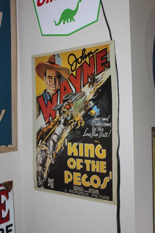 lot 23 image: John Wayne King Of The Pecos Metal Movie Sign