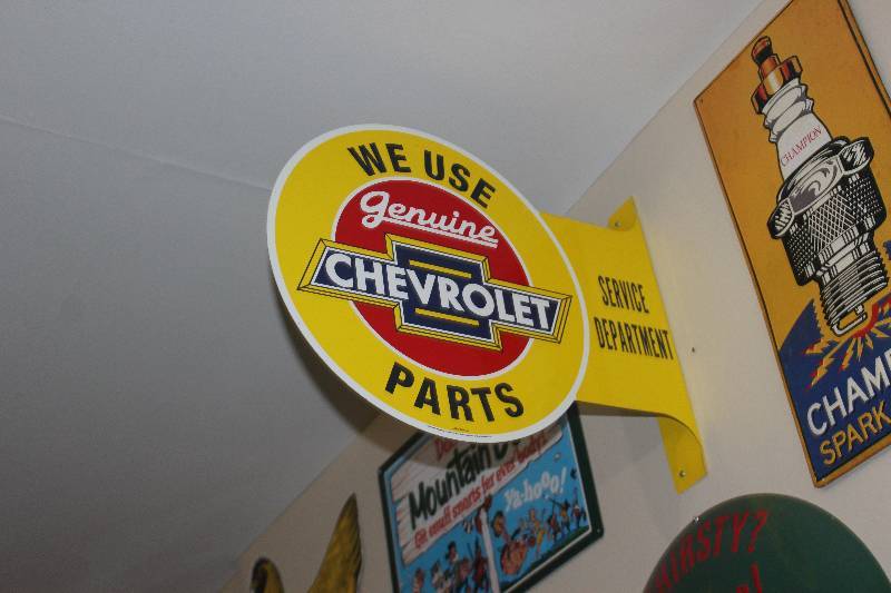 lot 43 image: We Use Genuine Chevrolet Parts Metal Sign