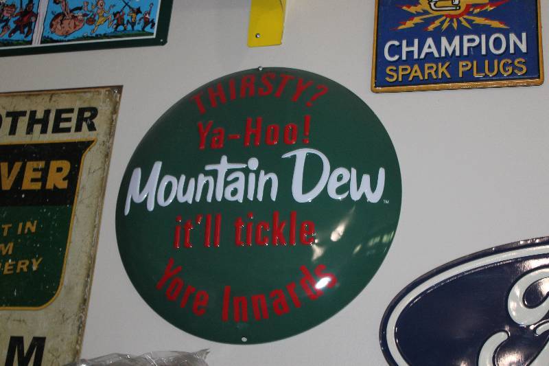 lot 44 image: Mountain Dew Metal Sign