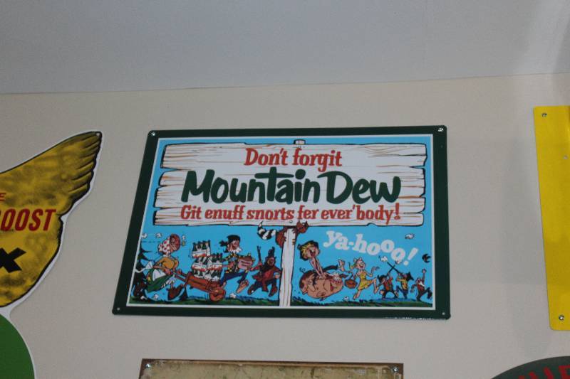 lot 46 image: Dont Forget Mountain Dew Metal Sign