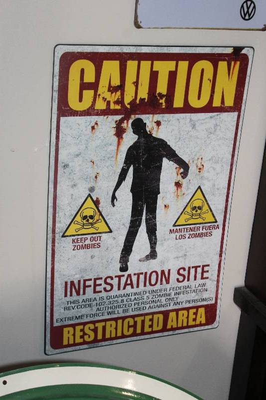 lot 54 image: Caution Infestation Metal Sign