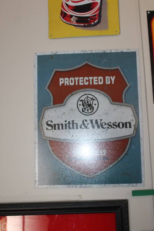 lot 56 image: Smith & Wesson Protected By Metal Sign