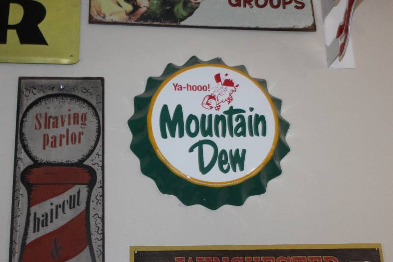 lot 65 image: Ya-hooo Mountain Dew Metal Sign