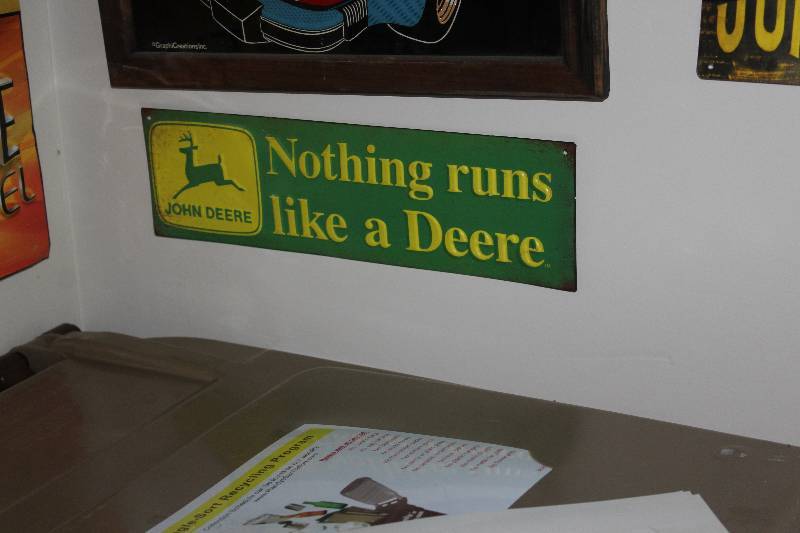 lot 74 image: John Deere Nothing Runs Like A Deere Metal Sign