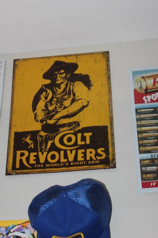 lot 102 image: Colt Revolvers Metal Sign