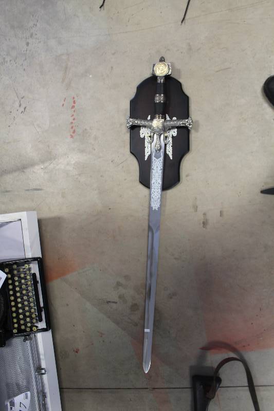 lot 255 image: Black Handle Sword w Wall-Mount Holder