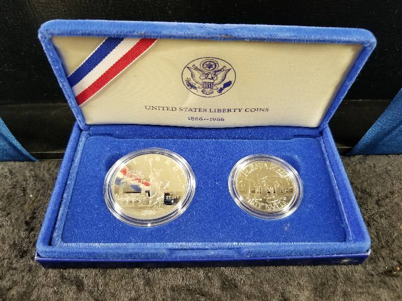 lot 13 image: 1986 Liberty Silver Dolar (90% Silver) & 1986 Half Dollar, In Velvet Case, COA